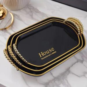 Luxury black and gold serving tray set with elegant beaded handles, perfect for serving drinks, snacks, and home décor. Stylish, durable, and space-saving design for kitchens, coffee tables, and special occasions.